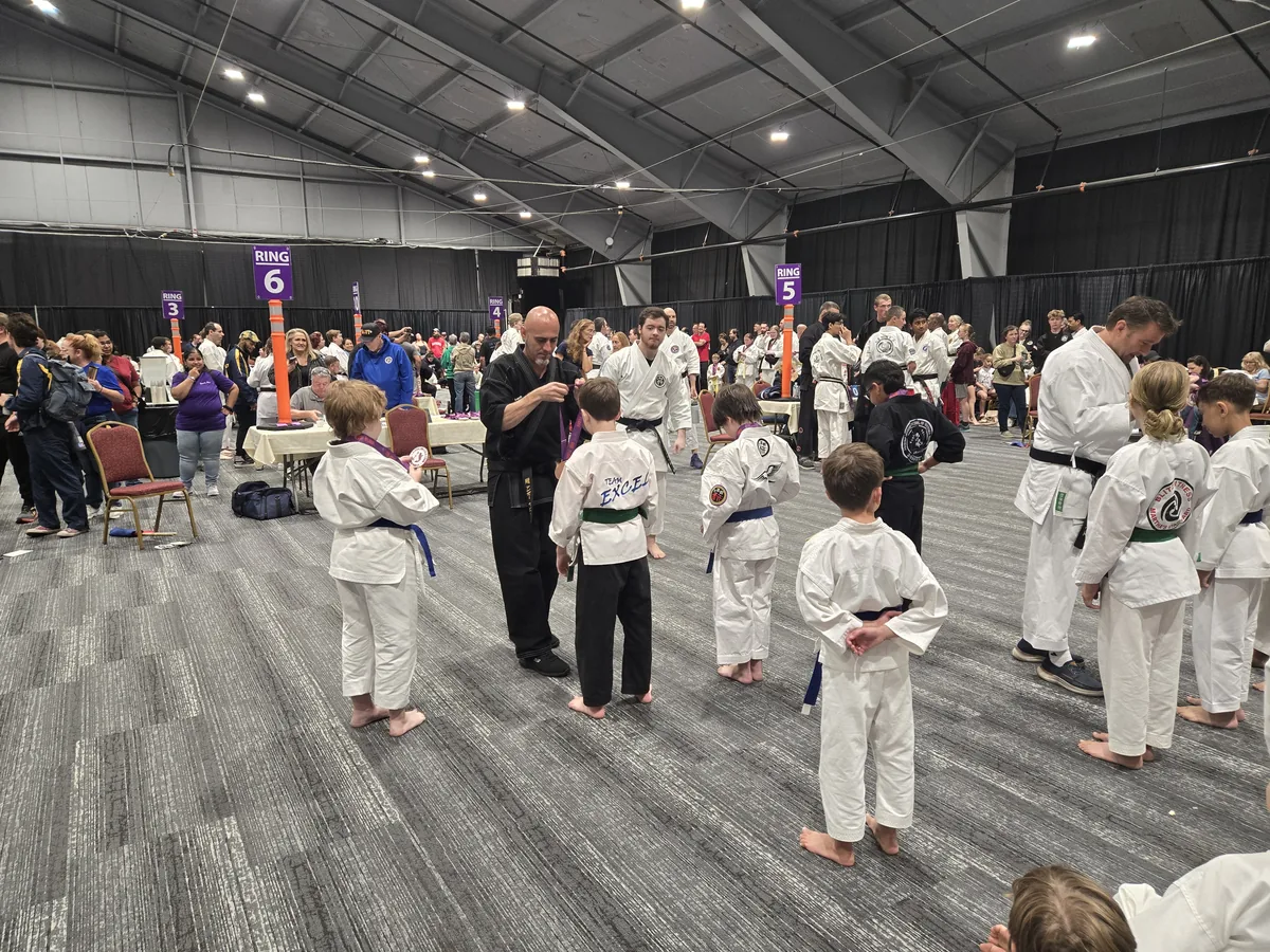 Young students lined up at a karate tournament